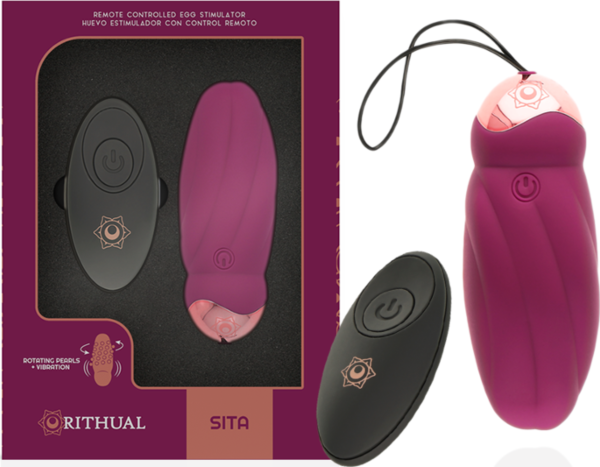 Ou vibrator Rithual Sita cu rotire, lângă telecomanda sa